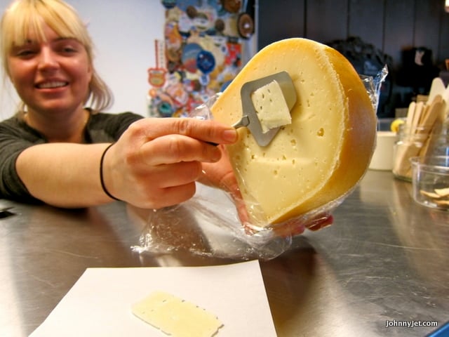 Trying a slice of the Winchester Gouda at the Cheese Cave