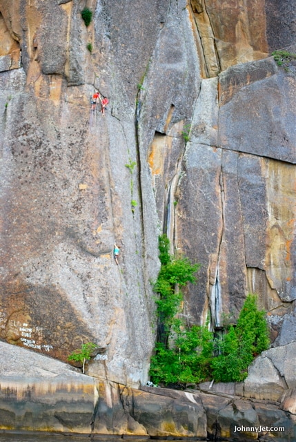Perspective -- these rock climbers show how expansive are the cliffs and rocks along the Fjord.