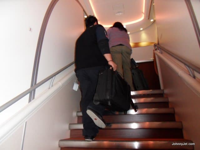 A porter lifting my bag up the stairs