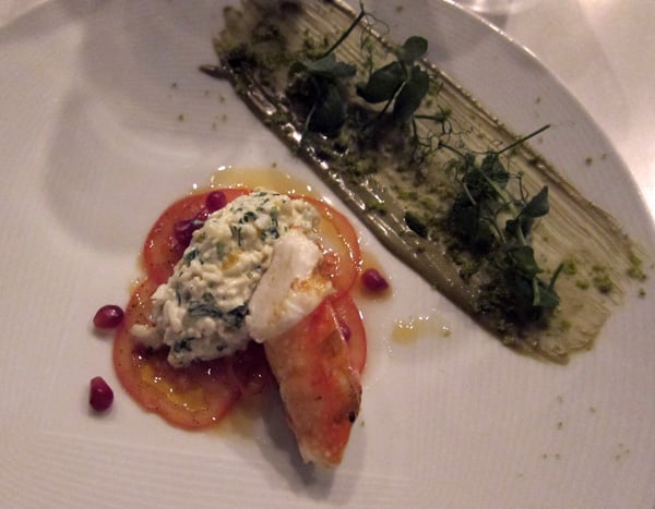 Grilled red king crab with marinated tomato, pomegranate salsa, lemon and pistachio confit