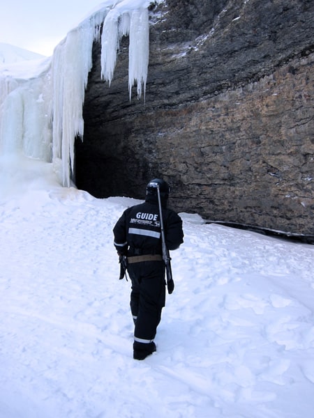 Checking out the frozen waterfalls to make sure its safe to explore