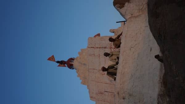 The men and a monkey at the Hanuman Temple