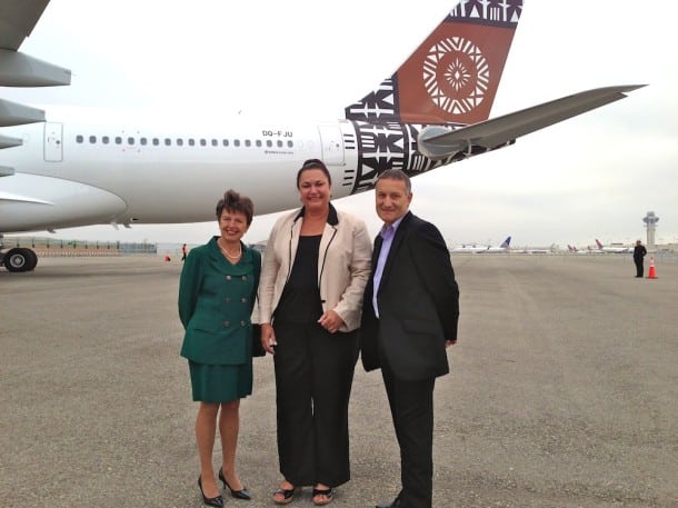 Fiji Airways executives celebrate, including permanent secretary Elizabeth Powell (center) and acting CEO Aubrey Swift (right).