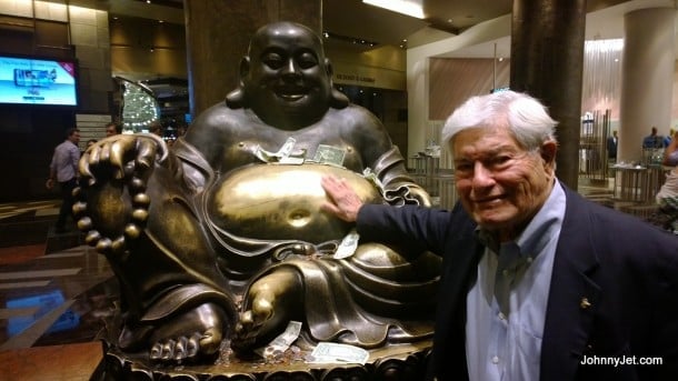 Rubbing Budha's belly at Aria Hotel