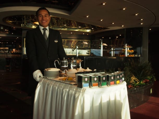 High tea in the Yacht Club's Top Sail Lounge served by the happiest guy