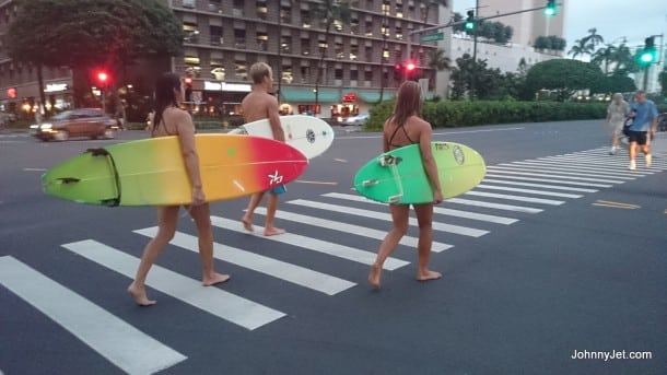 Surfers walking the streets of Honolulu