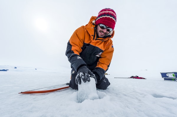 Michael pulling up ice core samples (Credit: Jason Edwards National Geographic)