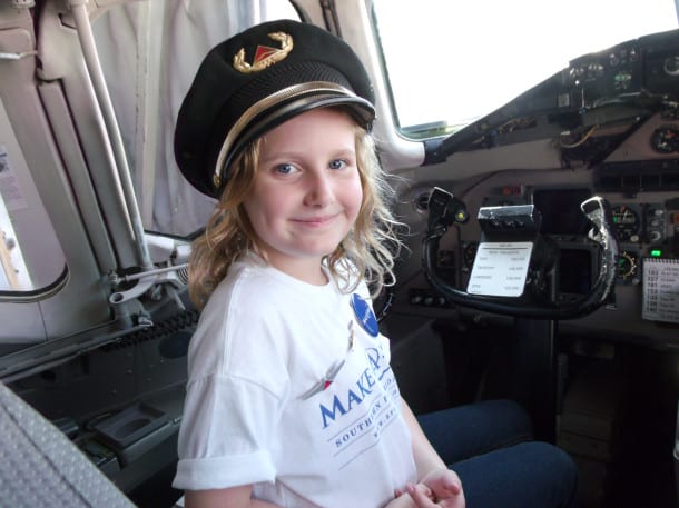 10-year-old Simone, who has a life-threatening nervous disorder, in the cockpit before her dream trip to New York City
