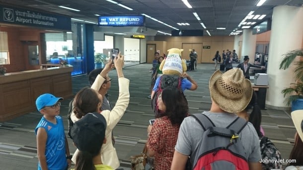 Passengers taking a picture of a traveler at Don Muang Airport (DMK)