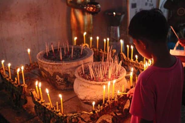 Boy lighting candles