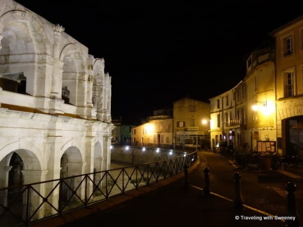 Roman arena and quiet street in Arles at night