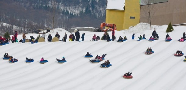 Tubers race each other down the hill at Camelback Snowtubing Park