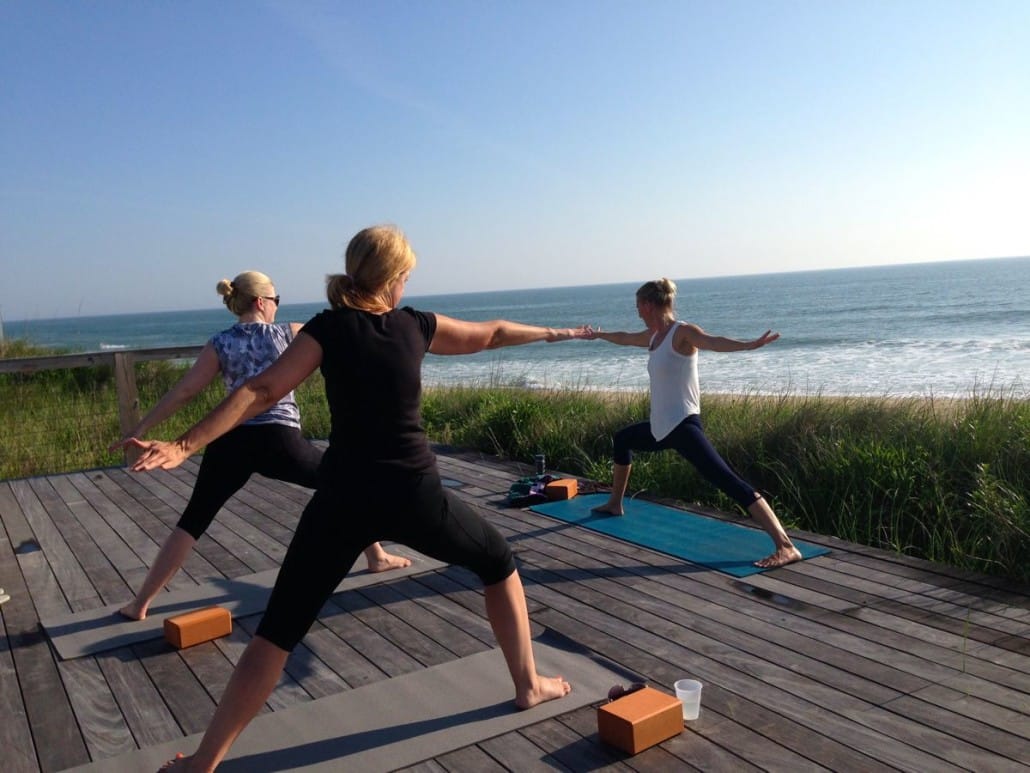 Yoga on the beach at Sanderling's