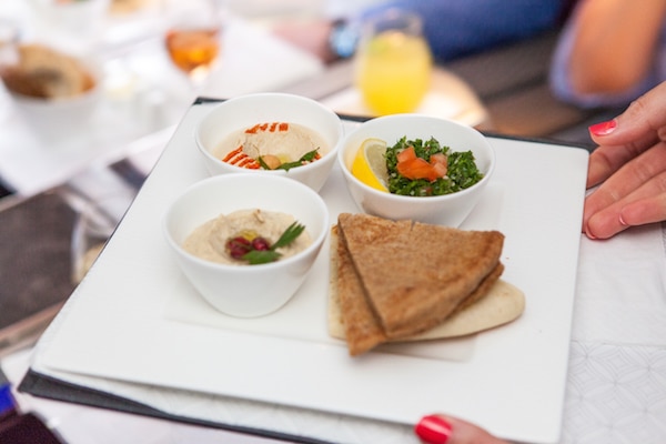 Classic Arabic mezze hummus, tabouleh and moutabel served with Arabic bread (Credit: Russ Kuhner)