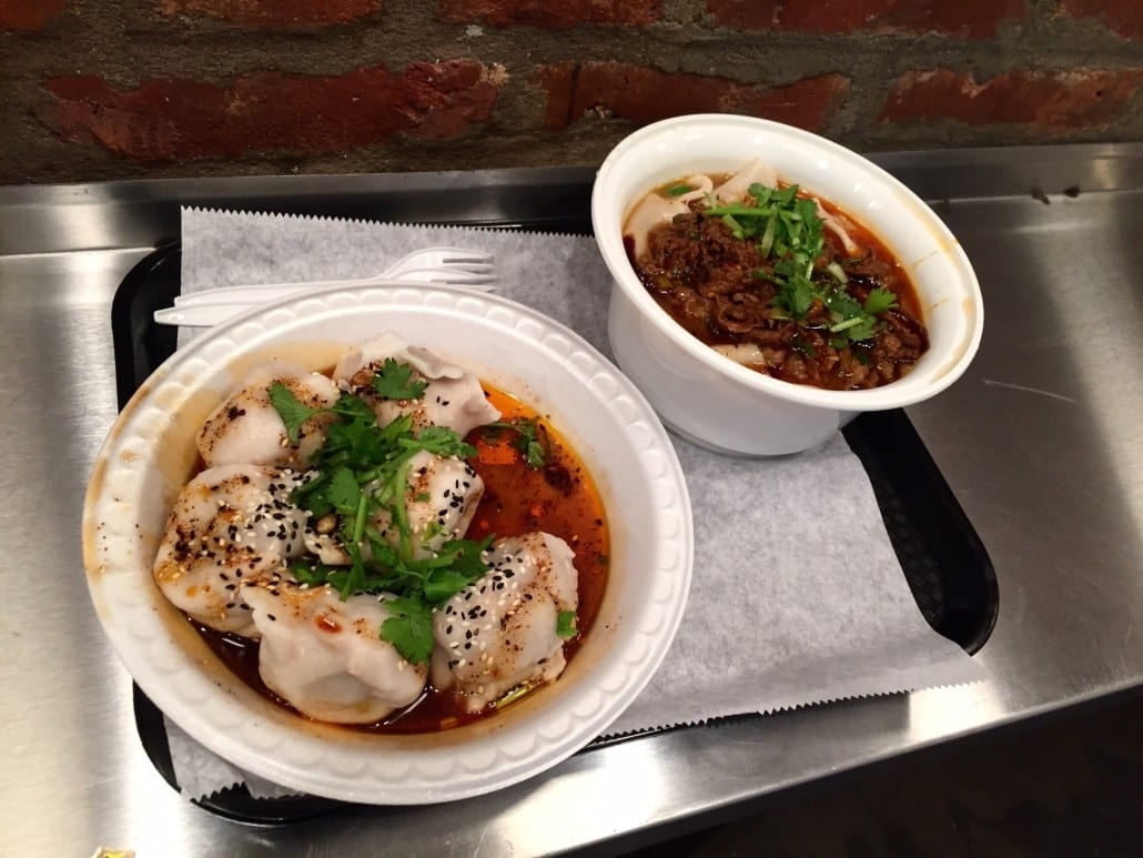 Spicy and sour lamb dumplings and spicy cumin lamb hand-ripped noodles in soup from Xi'an Famous Foods