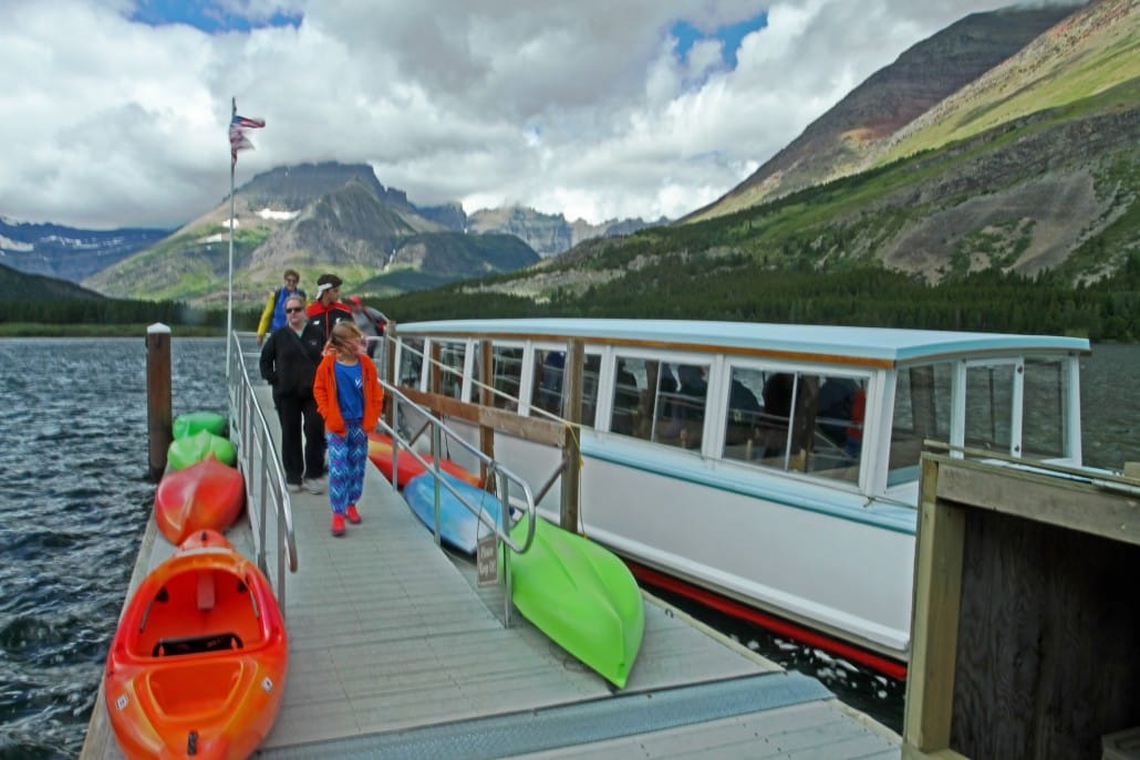 Passengers disembarking excursion boat on Swiftcurrent Lake (Credit: Bill Rockwell)