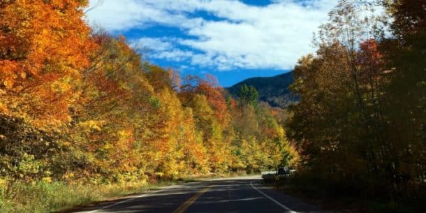 Once you determine what to bring on a road trip, you can enjoy views like this Mountain Road in Stowe, Vermont. Photo by Johnny Jet