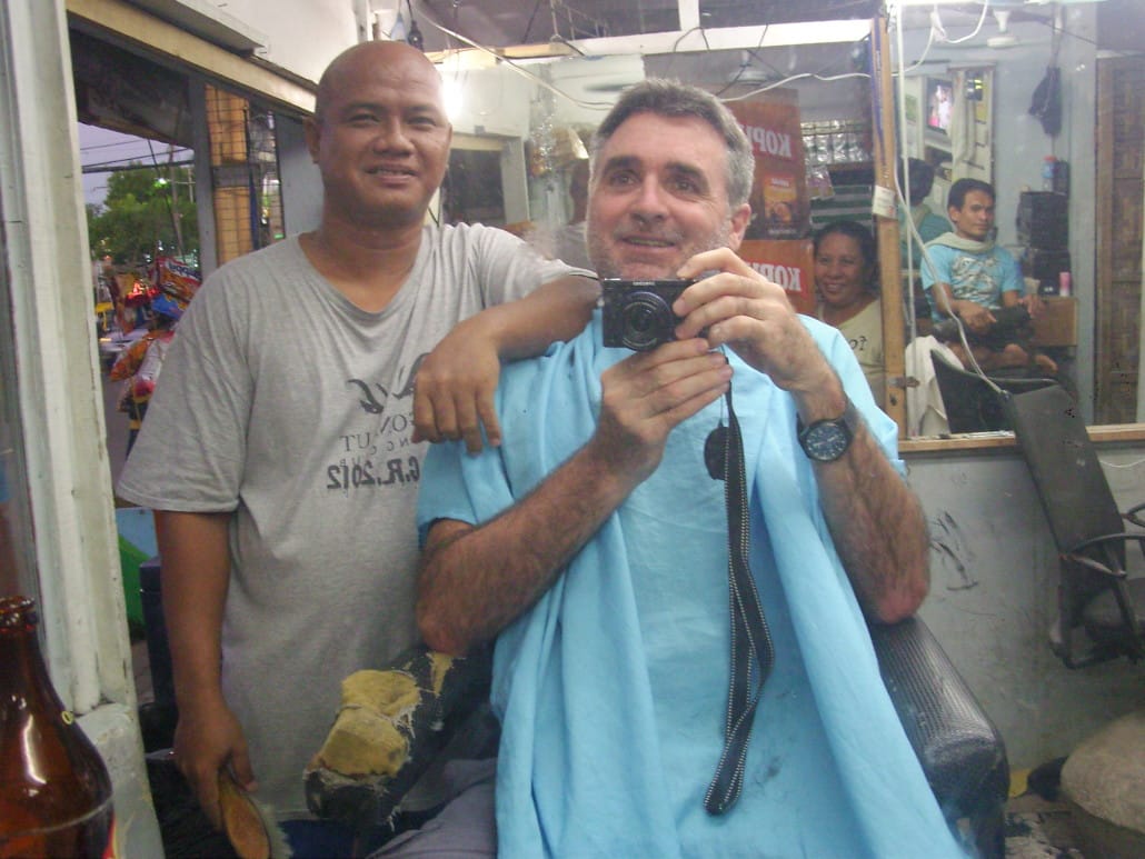 Author getting a trim at PJ’s Barber Shop, Lapu-Lapu City, Philippines