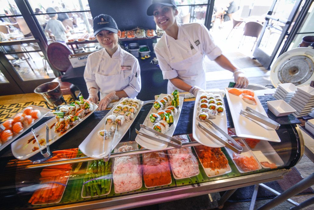 Cheerful sushi chefs at the Sunday brunch buffet at Catalina Kitchen