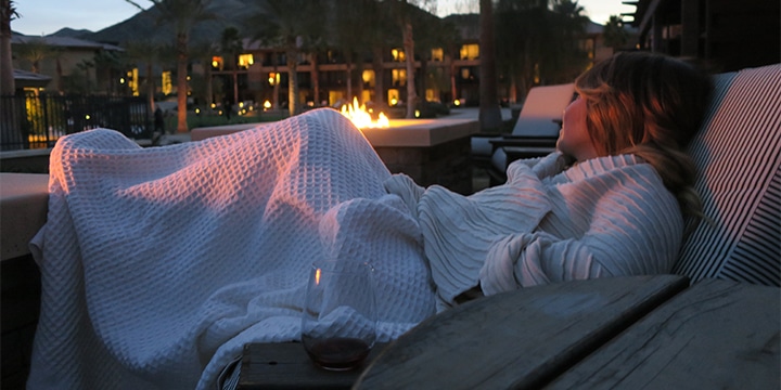 Relaxing with some by the fire outside our room at The Ritz-Carlton, Rancho Mirage