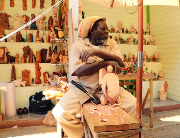 A wood carver in a Nassau market (Credit: Bill Rockwell)