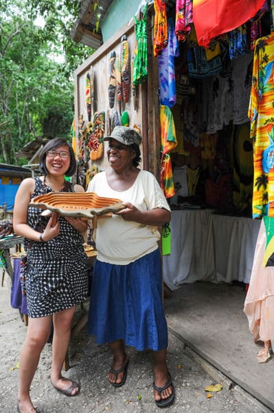Vendors selling jewelry and wood carvings line the road of Fern Gully