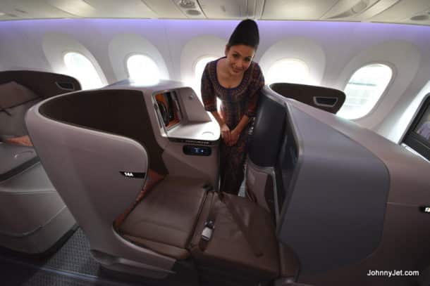 Flight attendant showing off Singapore Airlines's 787-10 business class seats from March 2018. Credit: Johnny Jet