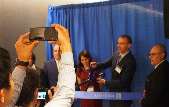 United VP of Marketing Mark Krolick cutting the ribbon to open the lounge this morning