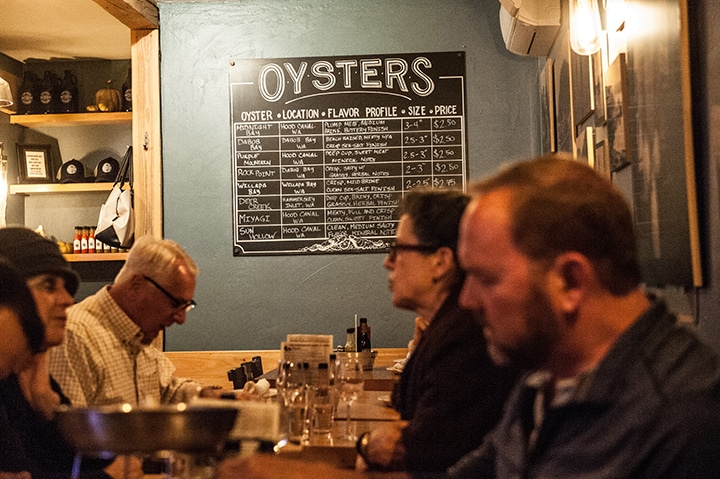 The chalkboard at Saltwater Fish House & Oyster Bar tells you all you need to know about the house oysters