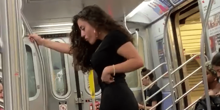 Woman's selfie photoshoot on the NYC Subway