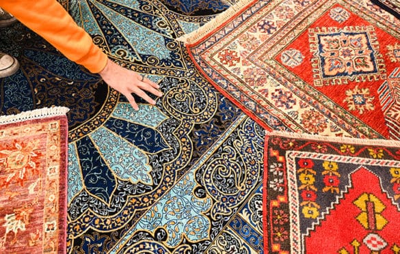 Detail of several rugs at Nakka's Cistern carpet showroom