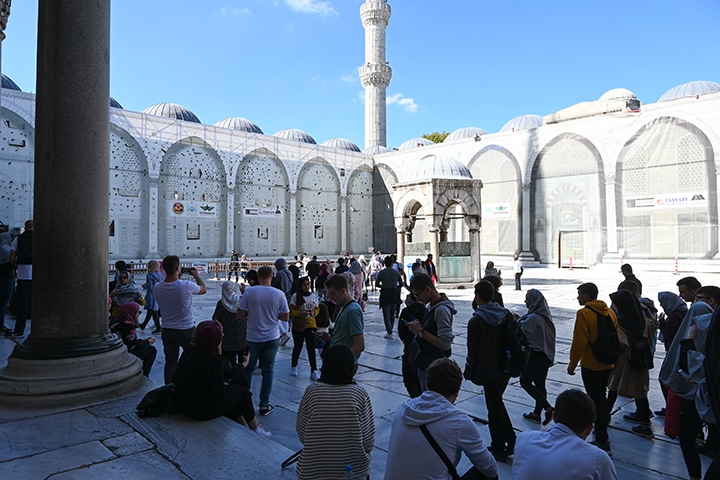 Visitors gathering in the courtyard of Sultan Ahmed Mosque