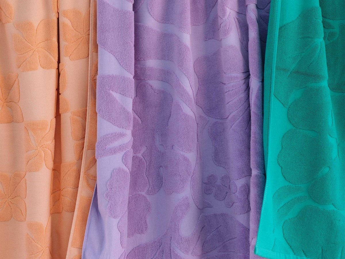 Aloha beach towels in three different colors.