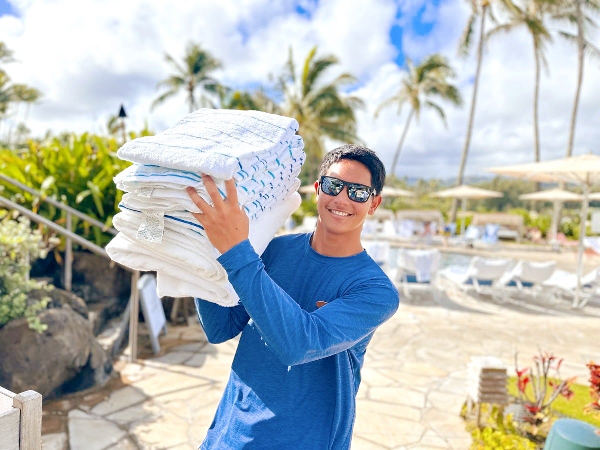 Friendly man delivering pool towels at the Ritz-Carlton Oahu, Turtle Bay.