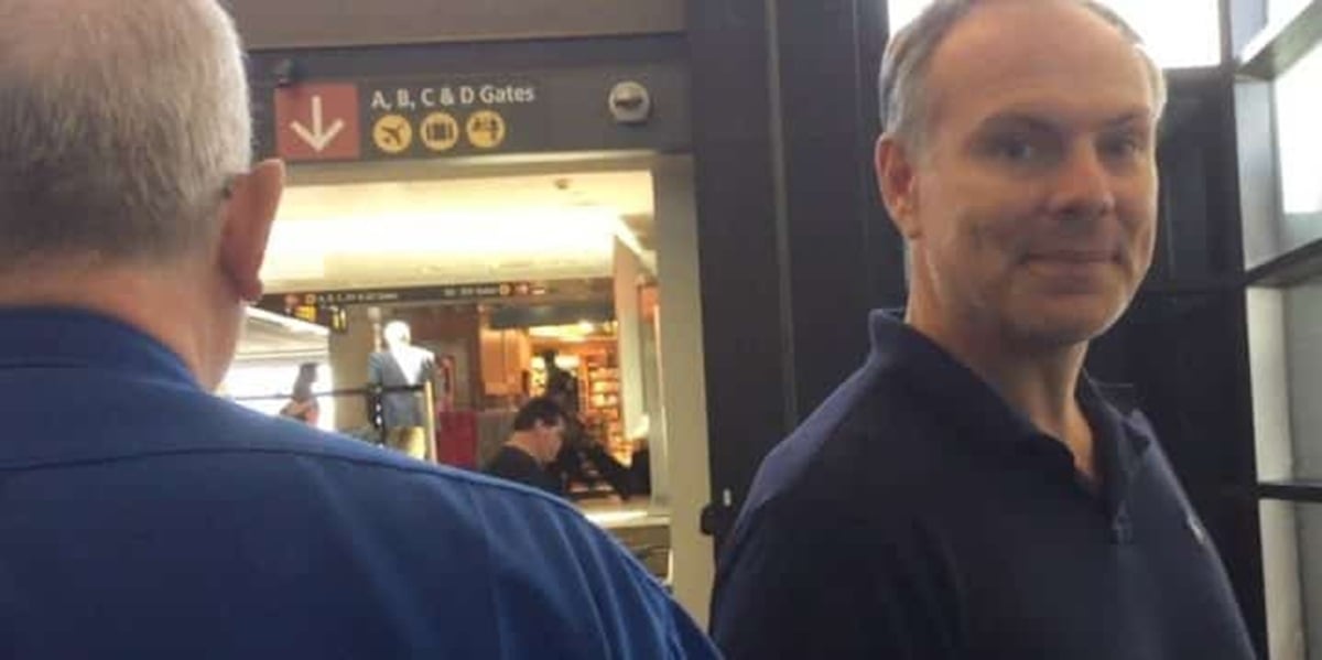 Johnny Jet with a disgust look on his face while being detained by airport security at SeaTac