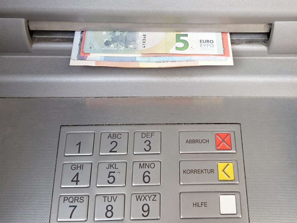 Euros being withdrawn from an ATM
