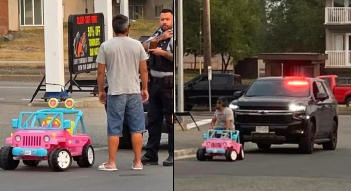A man being pulled over by police in a pink Barbie Jeep