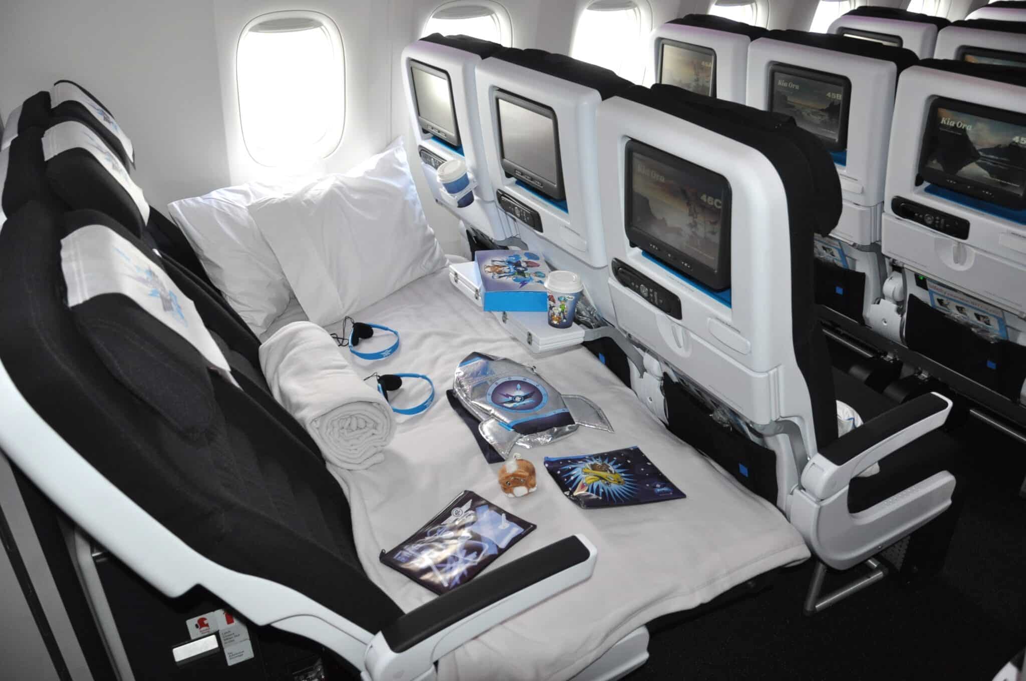 Photo of Air NZ's Sky Couch which is three seats of economy with bedding and pillows